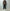 AURALEE「REVERSIBLE WOOL TWISTED TWILL / SHEEP LEATHER HALF COAT - BROWN CHAMBRAY × BLACK」