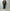 AURALEE「REVERSIBLE WOOL TWISTED TWILL / SHEEP LEATHER HALF COAT - BROWN CHAMBRAY × BLACK」