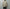 AURALEE「REVERSIBLE WOOL TWISTED TWILL / SHEEP LEATHER HALF COAT - KHAKI BEIGE CHAMBRAY × BLACK」