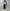 AURALEE「REVERSIBLE WOOL TWISTED TWILL / SHEEP LEATHER HALF COAT - KHAKI BEIGE CHAMBRAY × BLACK」