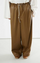 HED MAYNER 「AW22_P50_CML/LTH “JUDO PANTS BROWN FAUX LEATHER”」